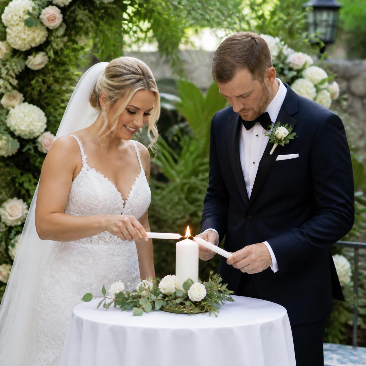 A couple lighting a unity candle together at a garden wedding